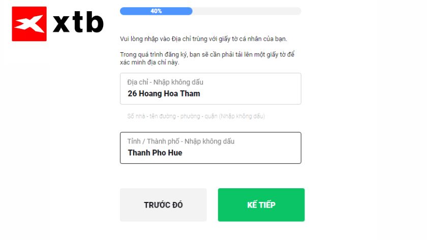 Hướng dẫn nhập địa chỉ đăng ký và điều hướng trong quá trình đăng ký XTB Form nhập địa chỉ đăng ký trên XTB với hướng dẫn nhập không dấu và các nút KẾ TIẾP, TRƯỚC ĐÓ