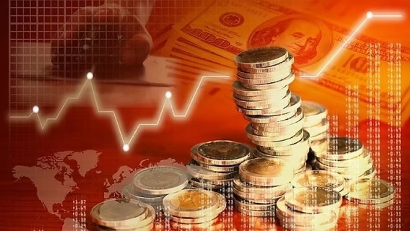 Phân loại theo tỷ giá hối đoái Các đồng xu xếp chồng lên nhau, nền là hình ảnh các tờ tiền đô la với tông đỏ.